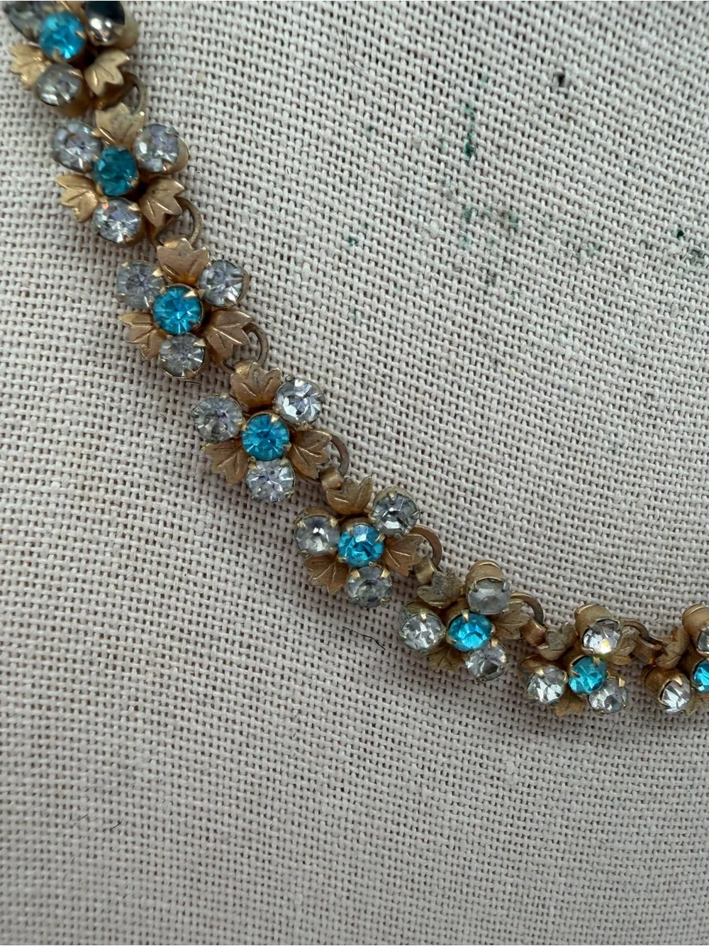 Vintage gold tone blue and clear rhinestone flower necklace